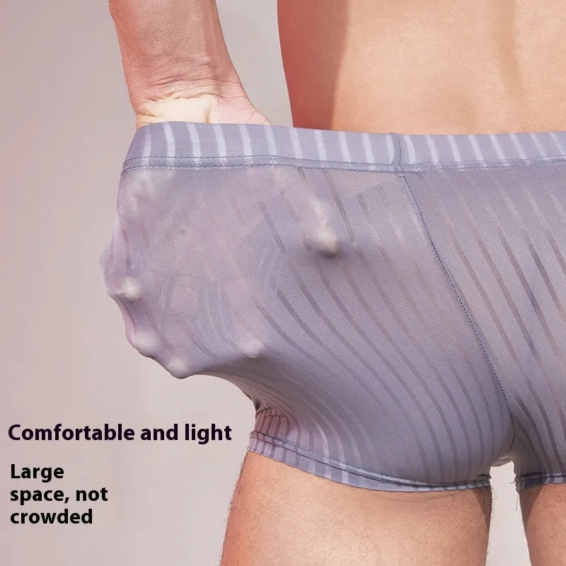 Men's striped low-rise underwear in thin transparent nylon, shown in black, dark grey, and white colours.