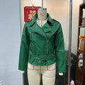Punk short black jacket with lapel, belt, and Peter Pan collar on a model.