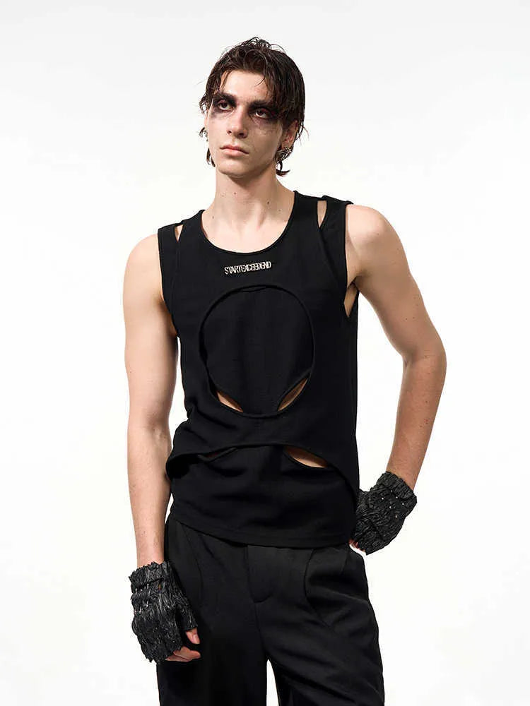 Man wearing a loose-fit black sleeveless hollow thread waistcoat vest.