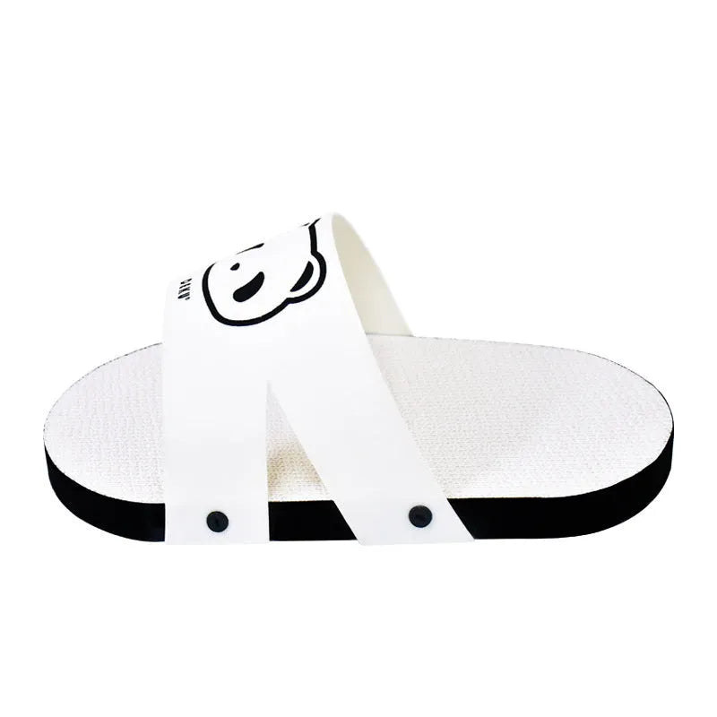 White slipper-style corrugated cardboard cat scratch board on a floor.