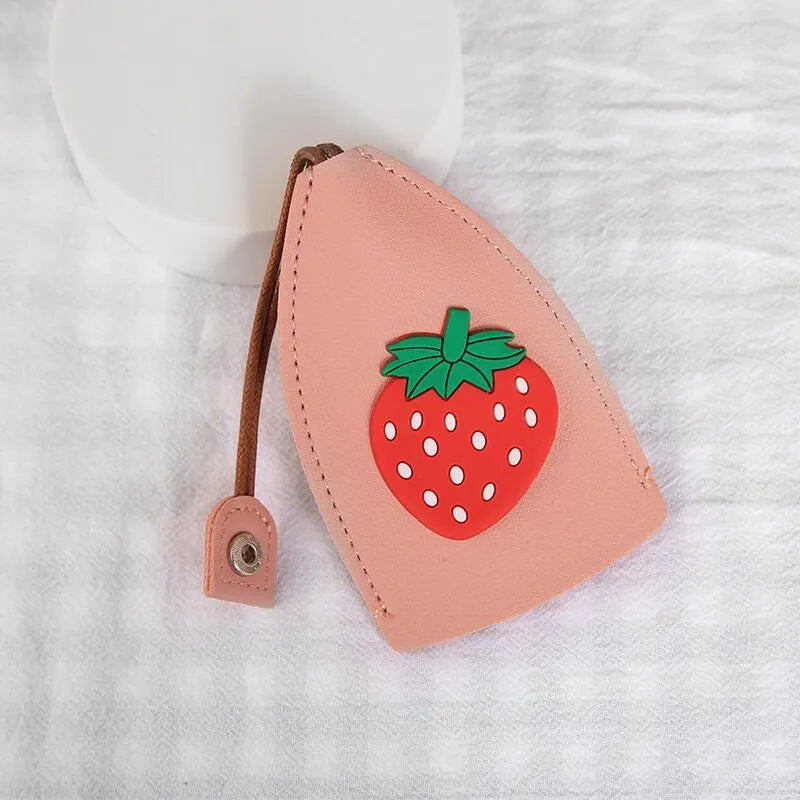 Cartoon pull-out key case in PU leather measuring 14 x 7.5 cm with colourful designs