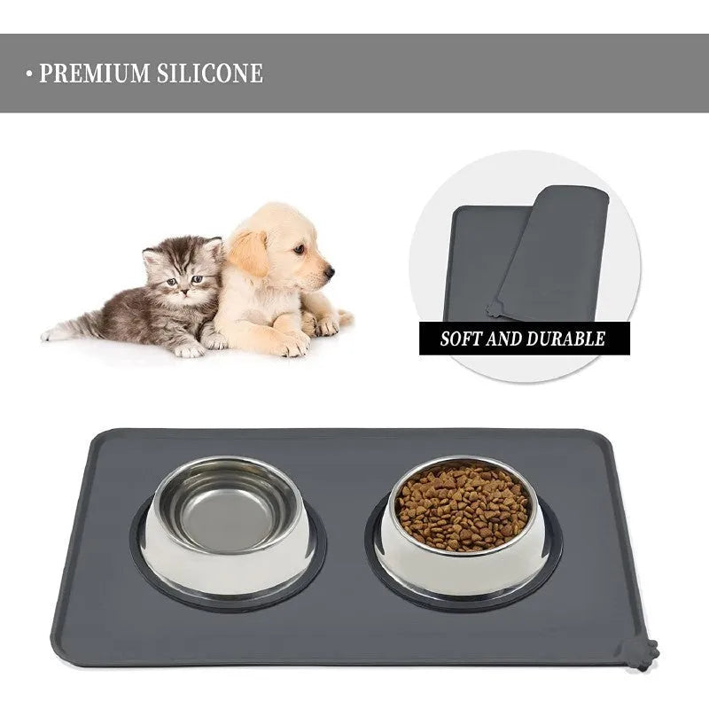 Large grey silicone pet placemat with a raised edge, holding a dog bowl on a wooden floor.