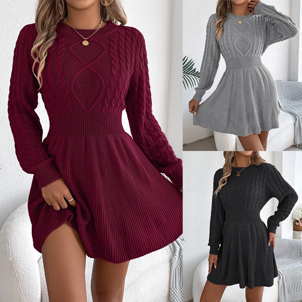 Woman wearing a black lantern sleeve sweater dress with an elastic fitted waist.