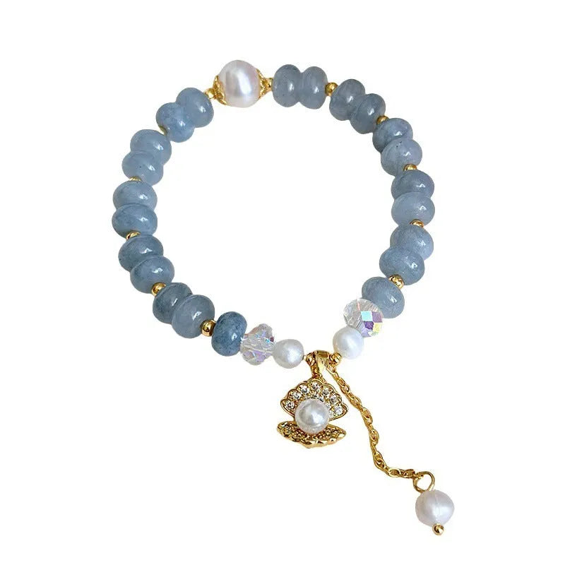 Natural aquamarine pearl and shell bracelet on adjustable stretch cord