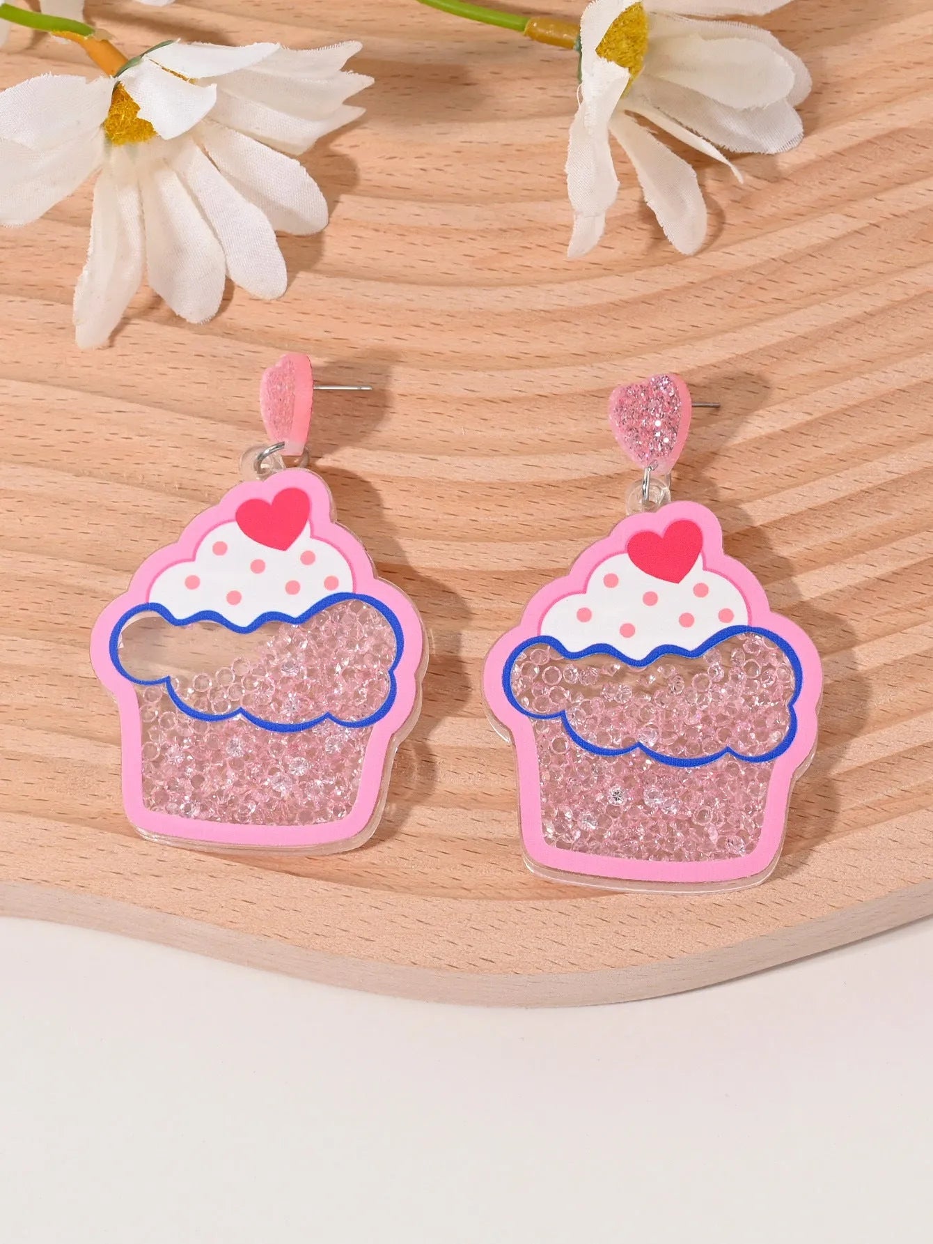 Colourful acrylic earrings with realistic fruit and dessert charms including cherry, strawberry, and ice cream.