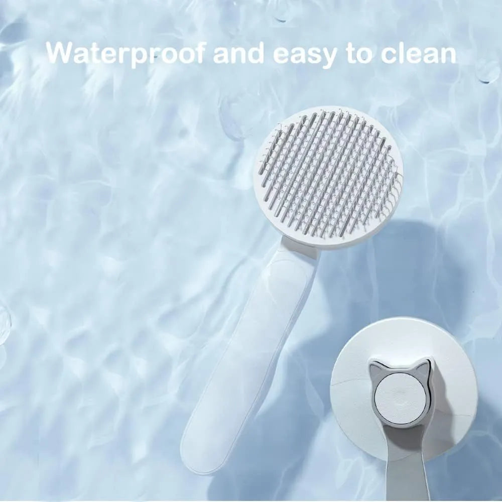 Blue self-cleaning cat and dog grooming brush with rubber-tipped pins and a non-slip rubber handle.