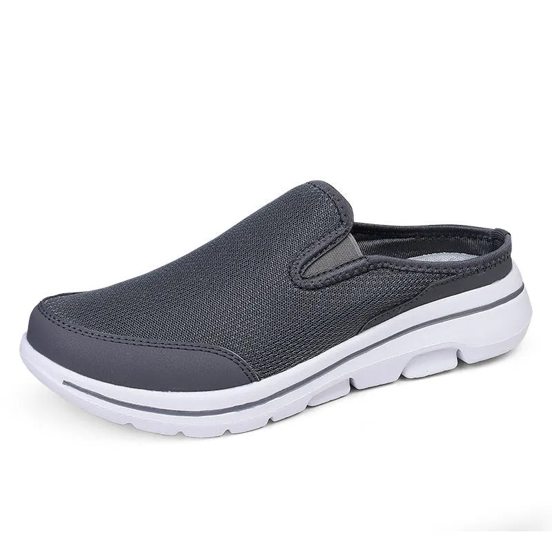 Women's light grey mesh toe holder slippers with a flat sole on a white background.