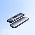 USB-C docking station adapter showing either 5-in-1 or 9-in-1 port configuration on a compact 9cm body.