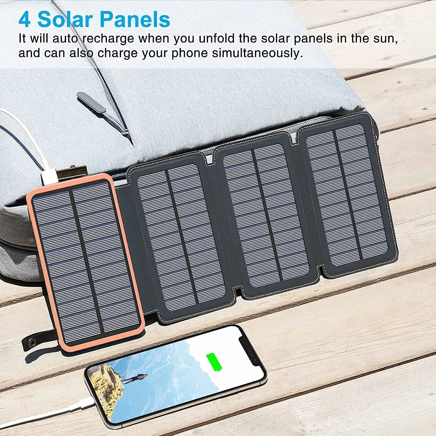 Black outdoor solar power bank with a solar panel and a built-in LED light displayed on a rock.