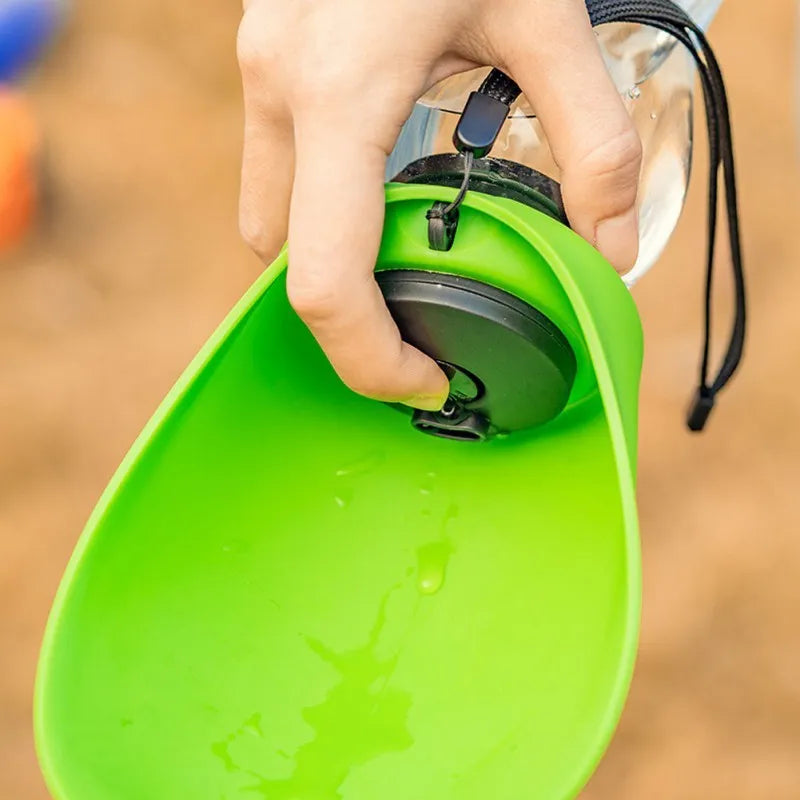 Portable pet water bottle with drinking bowl in blue green orange red colours showing 680ml capacity and key lock