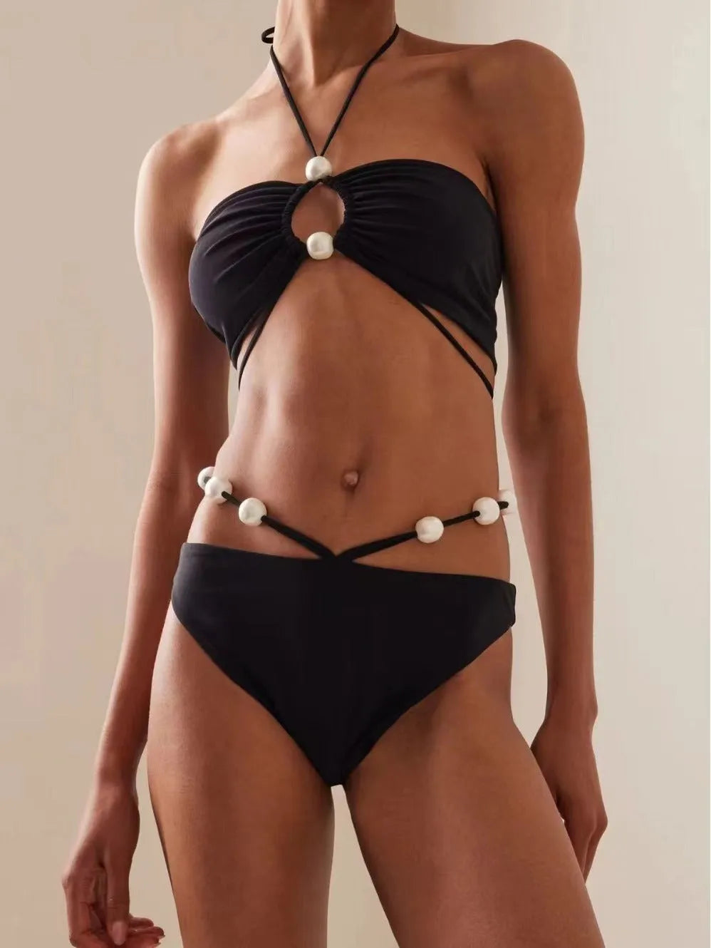 Women's black lace-up bikini swimsuit with adjustable design and quick-drying fabric