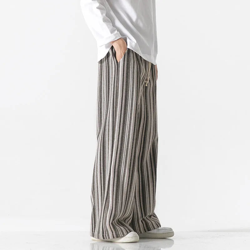 Vintage stripe loose straight leg mopping pants in cotton blend fabric on a hanger