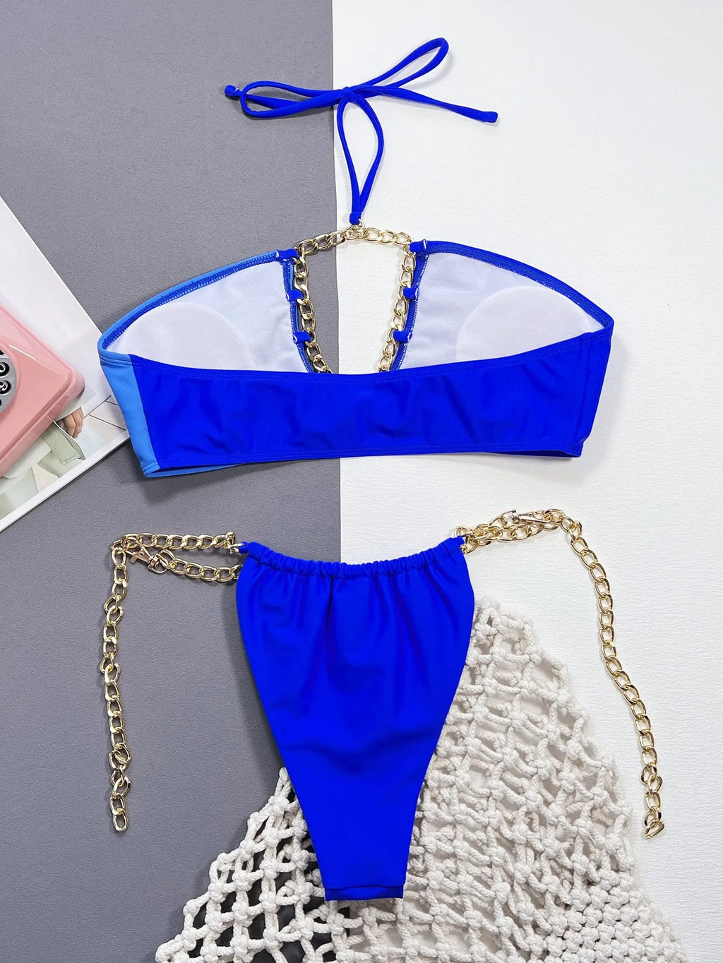 Solid blue women's split bikini swimsuit on a white background