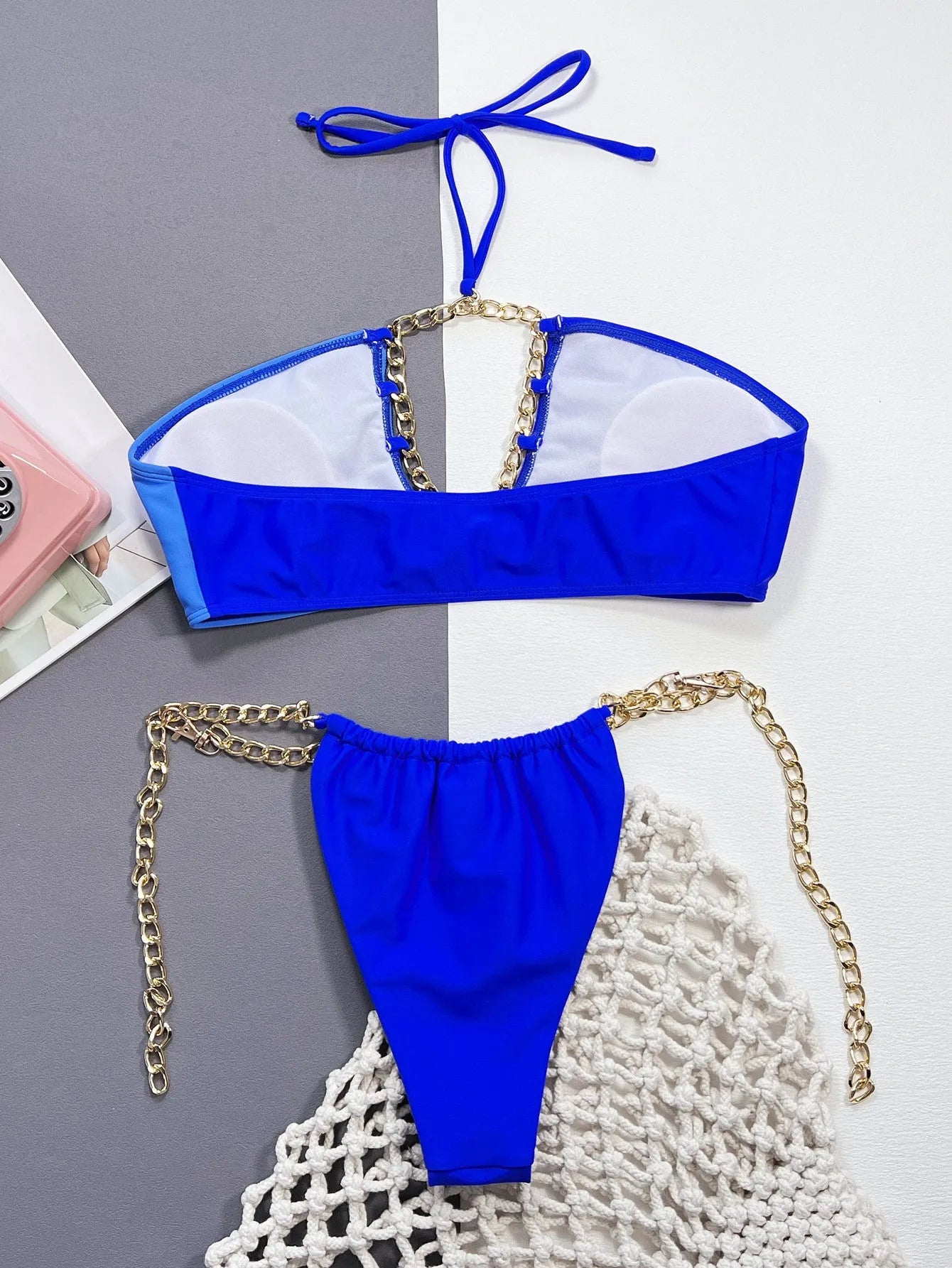 Solid blue women's split bikini swimsuit on a white background