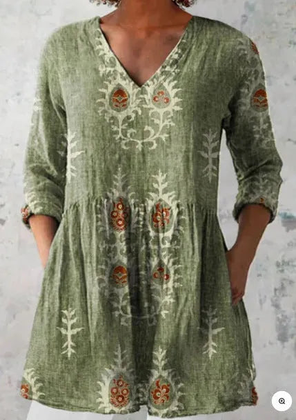 Women's loose-fitting long dress with a blue wave pattern print and 3/4 sleeves.