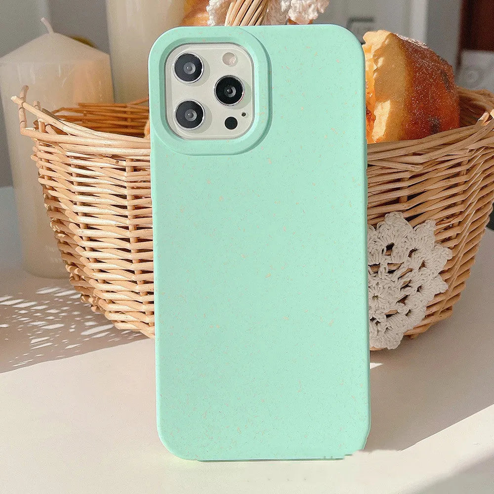 Wheat straw fibre degradable rear cover case for Apple iPhone on a table.