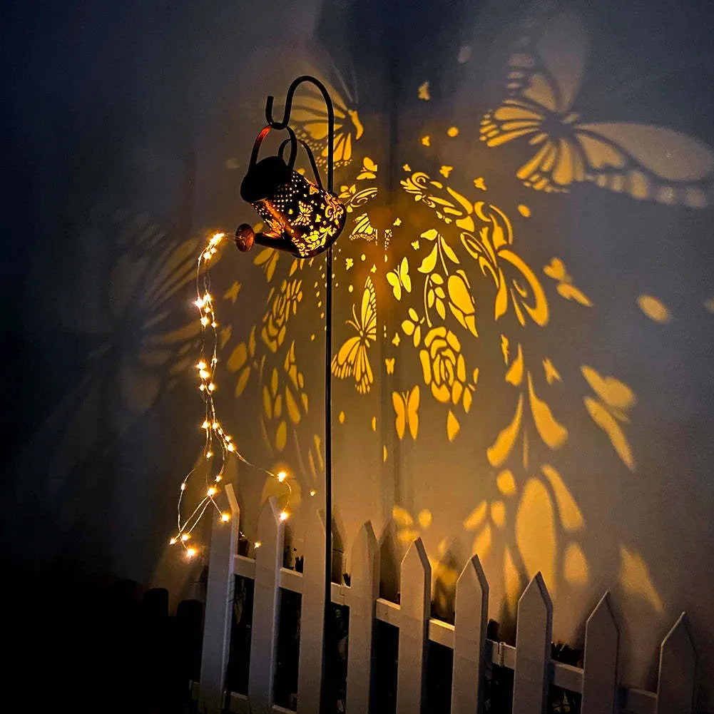 Solar-powered iron garden lantern with butterfly pattern and warm white LED light.