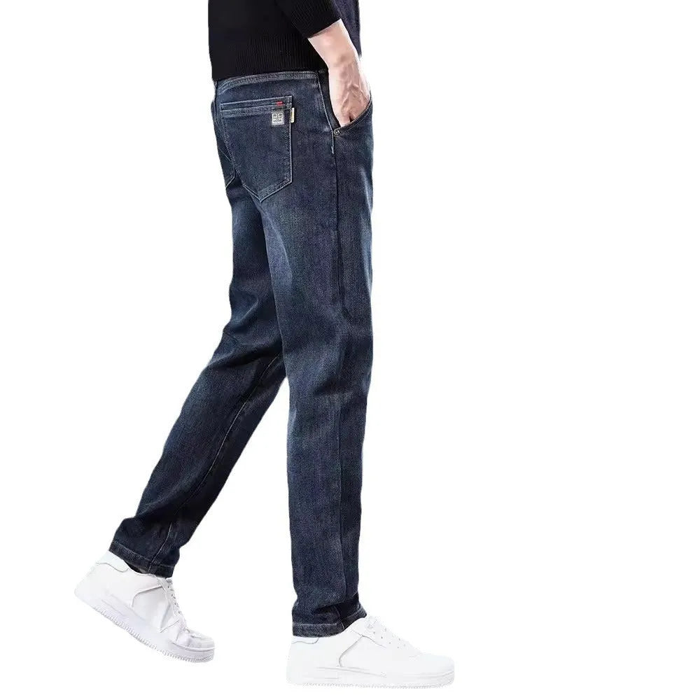 Man wearing slim straight blue-grey casual trousers with a micro-elastic waist for street fashion summer wear.