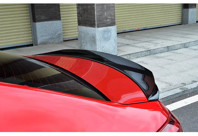 Bright black Mazda 3 tail trim for 2014-2021 models with large fixed wind surround design