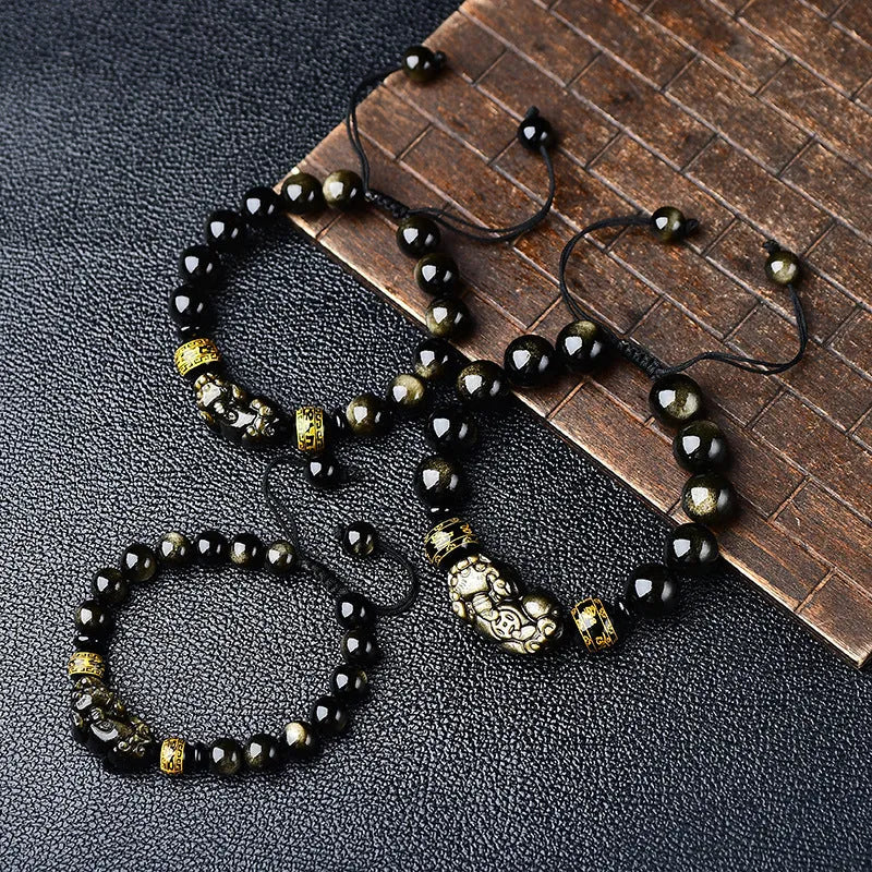 Natural golden obsidian Pi Xiu bracelet with hand-woven cord, showing four bead size options