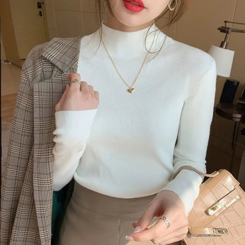 Slim fit viscose long sleeve top for women in apricot colour, showing front view.