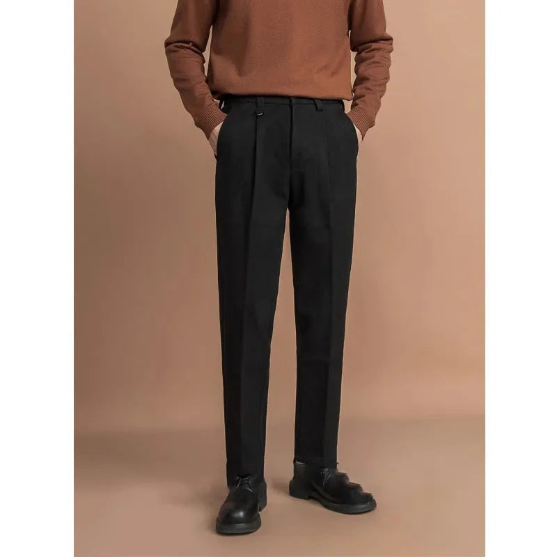 Man wearing straight leg grey suit pants for business casual attire.