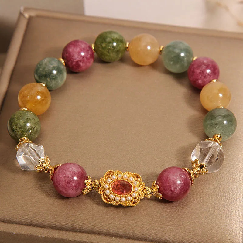 Close-up of a jade colour tourmaline bead bracelet on a pearl crystal base with alloy setting and rhinestones.