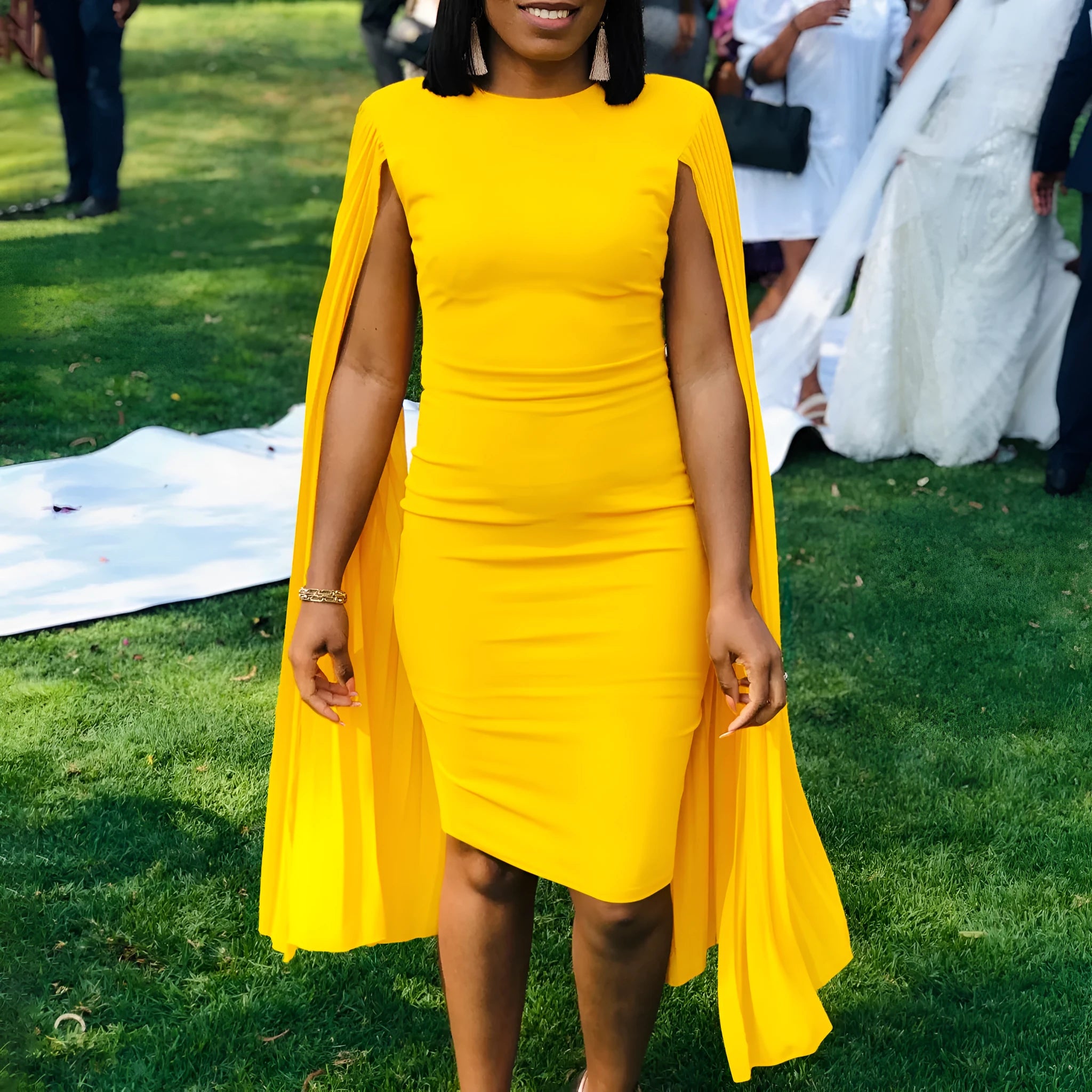 Long sleeve high waist pleated evening gown in yellow, orange, red, or green.