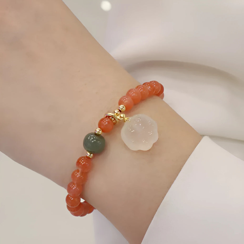 Natural red agate bracelet with 6mm beads and 8mm cat paw charm featuring gemstone inlay