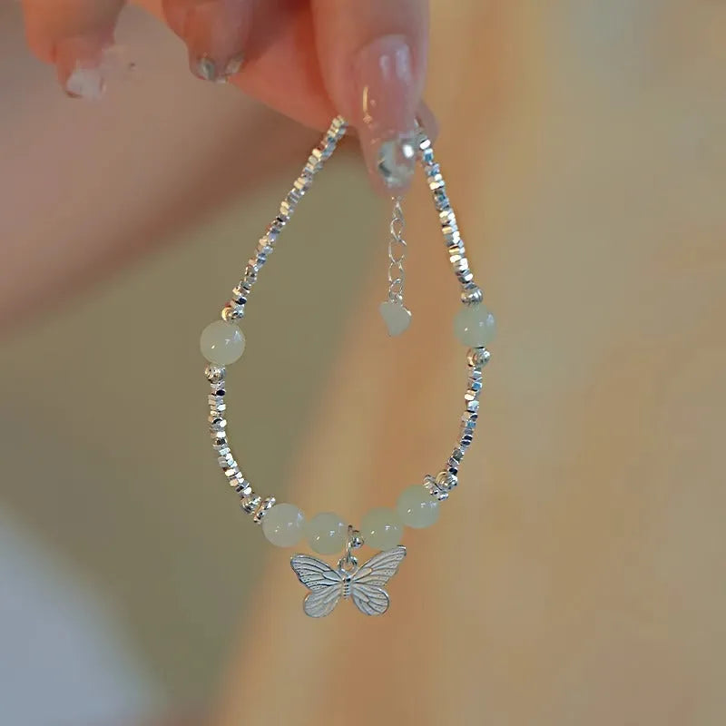 Women's butterfly jewellery set with bracelet and necklace featuring silver electroplated finish and Hetian jade details