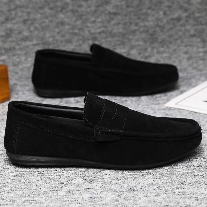 Men's Gommino Korean fashion slip-on shoes in black colour showing round toe and textured upper