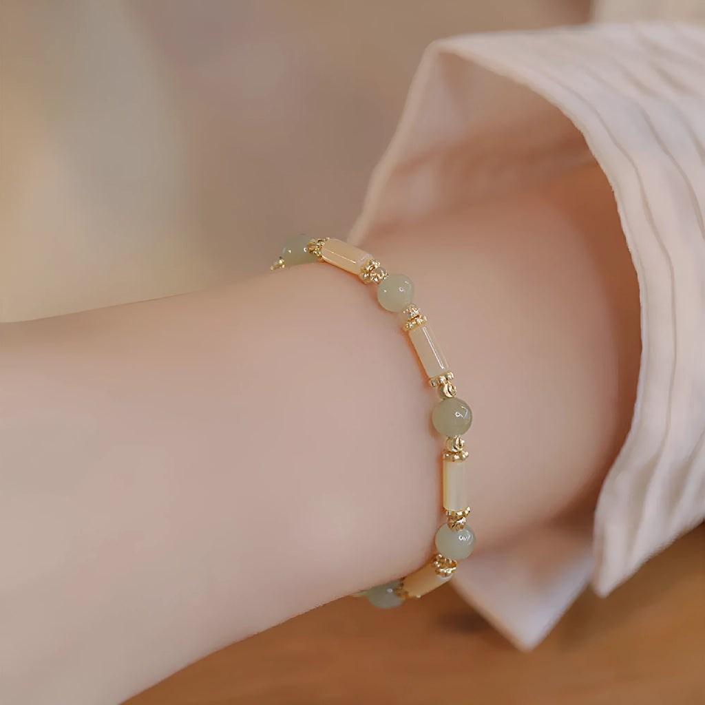 Women's Hetian jade bracelet with bamboo joint design in jade green and red colour options.
