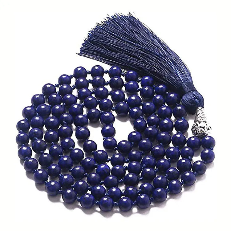 Long blue gemstone tassel necklace with agate, lapis lazuli, and turquoise beads on a geometric pendant.