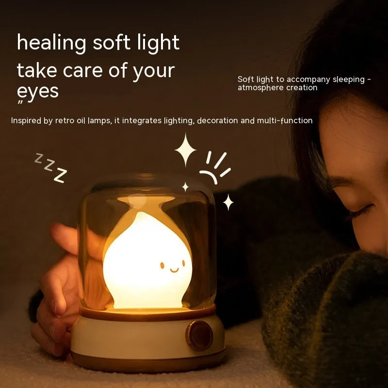 Green retro-style USB rechargeable LED night lamp with dimmer knob on wooden table