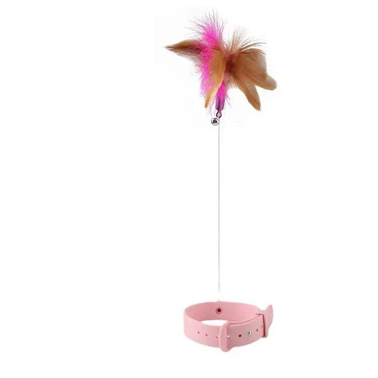Adjustable cat toy collar with feather bell attachment in pink or blue colour for cats with 17-27cm neck circumference