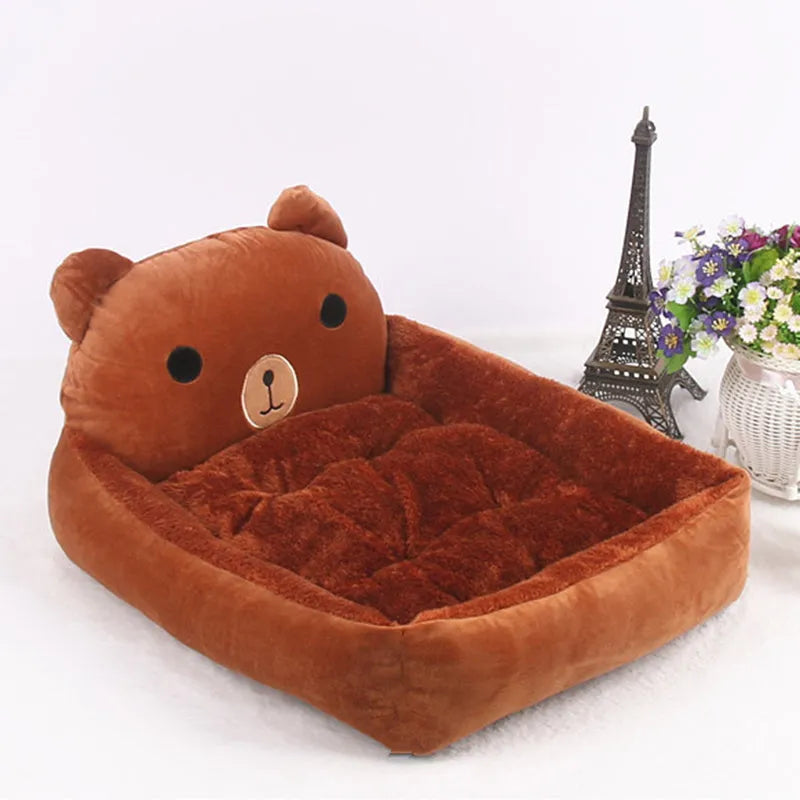 Cartoon-style plush pet bed sofa in blue, shown in small size for a dog or cat.