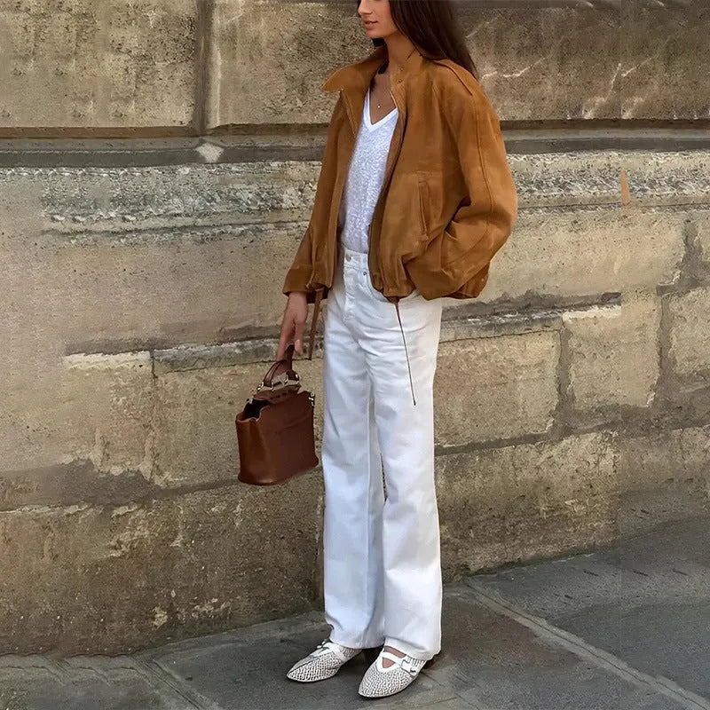 Man's solid colour retro loose-fit polyester jacket with long sleeves on a hanger.