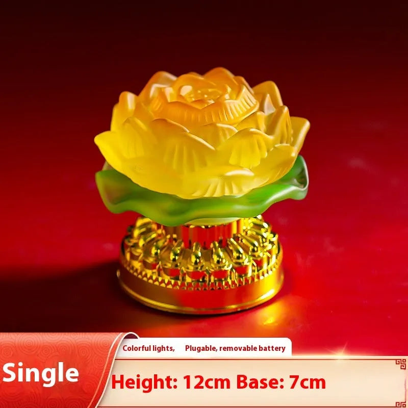 Yellow Chinese style lotus lamp on a table, showing flower bud and flowering design options.