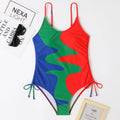Women's sleeveless one-piece swimsuit in blue with striped pattern, backless design.