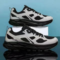 Pair of beige mesh casual running shoes with round toe and plastic sole on a white background.