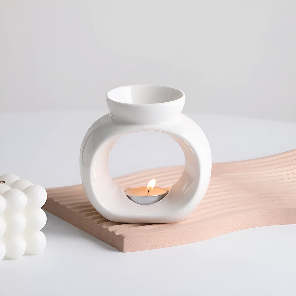 White Nordic style porcelain aromatherapy stove ornament on plain background