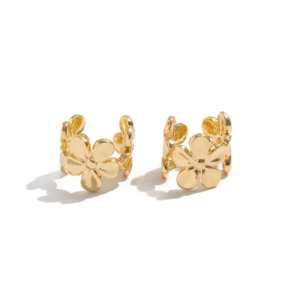 Gold electroplated alloy earrings with starfish and conch designs for women.