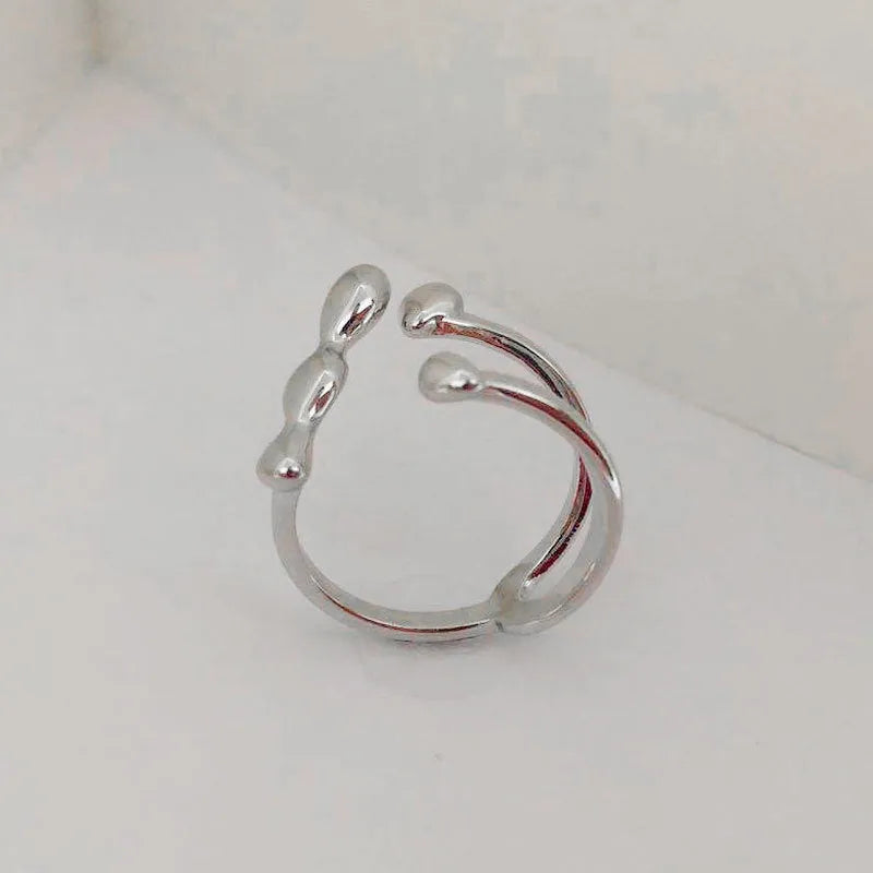 Brass opening ring with spherical elements in gold or silver finish, adjustable women's fashion jewellery