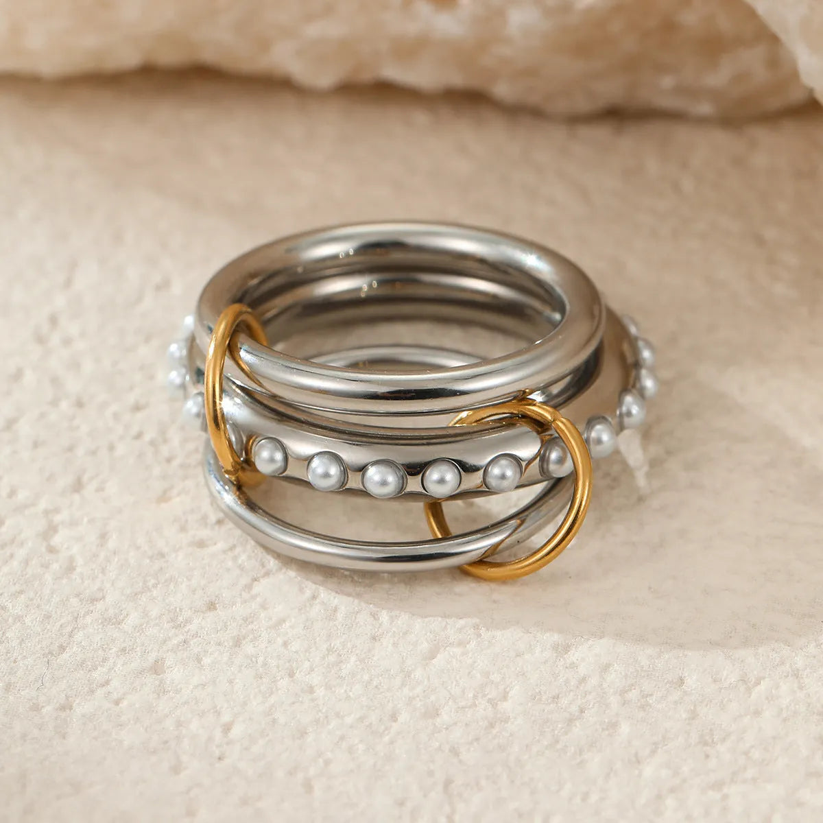 Women's gold-plated stainless steel stacked ring set in three colour options with exaggerated design