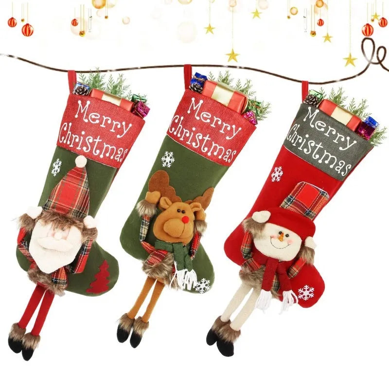 Three large Christmas stockings featuring Santa, Snowman and Reindeer designs with 3D applique decorations
