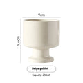 Hand-pinched irregular ceramic mug in solid colour with modern simple design