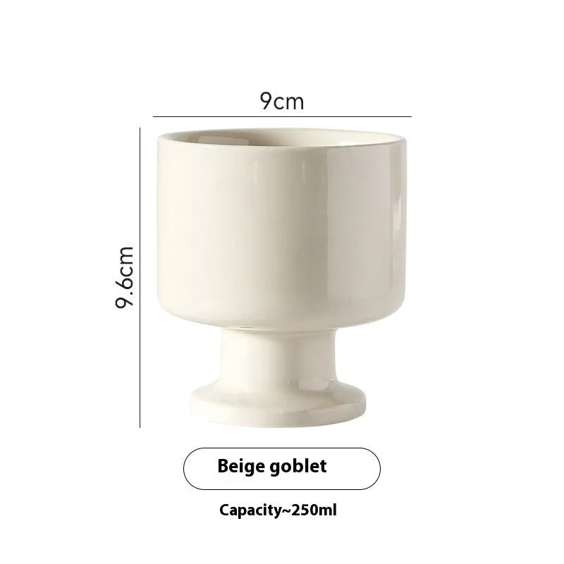 Hand-pinched irregular ceramic mug in solid colour with modern simple design