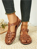 Dark brown women's vintage weave roman sandals with closed toe and buckle fastening on a soft rubber sole.