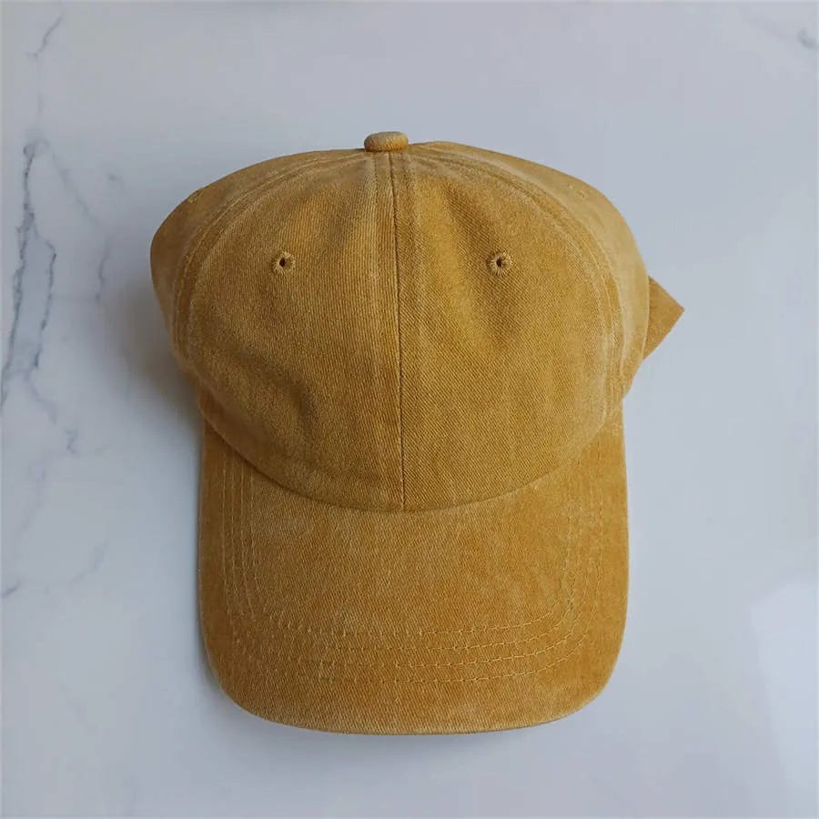 Retro washed cotton baseball cap with dome crown and peaked brim in 56-58cm size