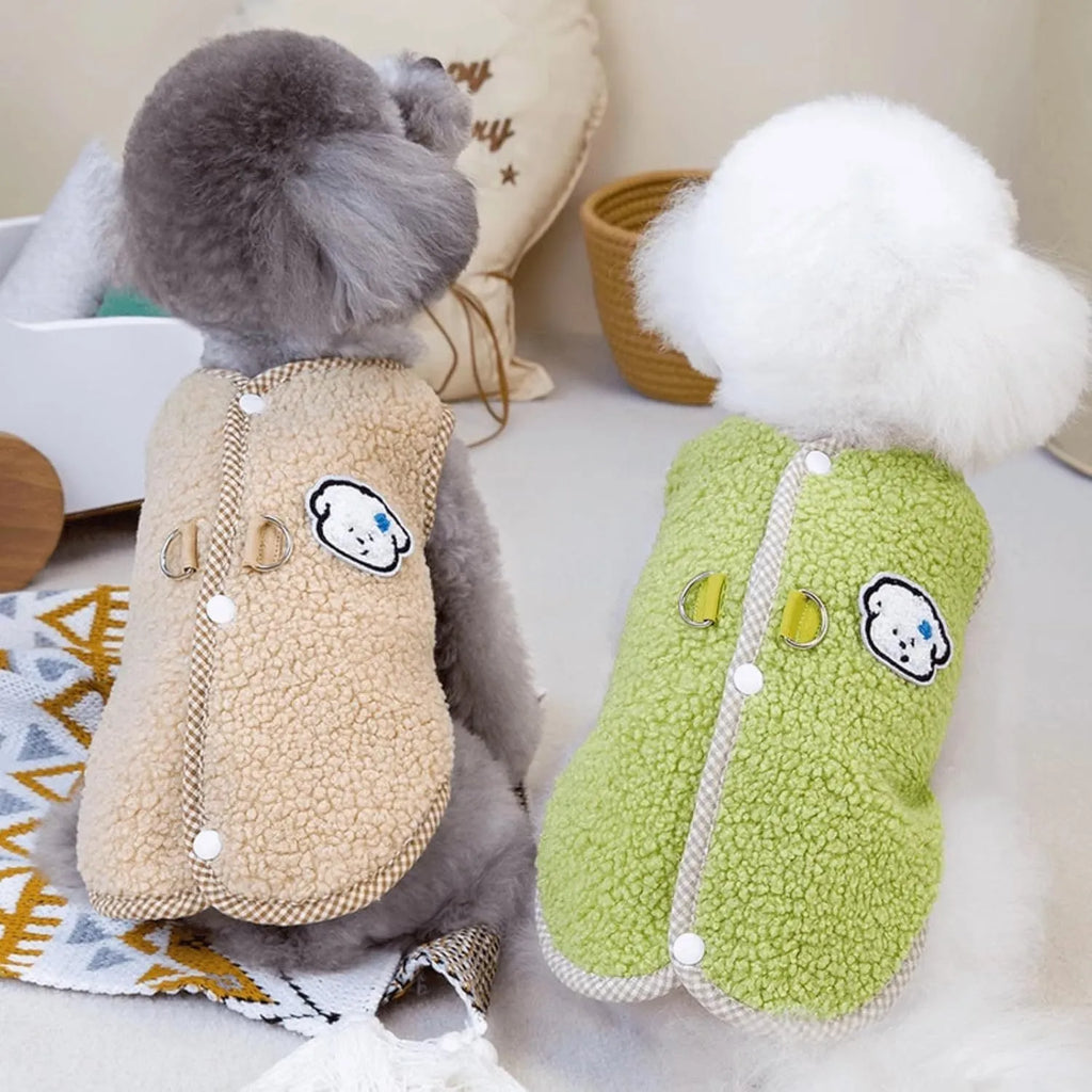 Green coral fleece dog vest with a leash ring on a small dog.